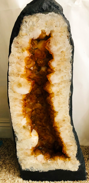 A very tall yellow tinted Citrine Quartz Crystal Geode, approximately 24 inches tall and weighing 30 pounds.